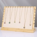 Bamboo jewelry display stand with seven gold necklaces featuring colorful crystal pendants - ZM009 Large Cream Velvet