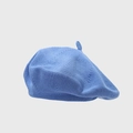 Detailed view of the fine knit texture and small tip on a light blue cotton beret hat - One Size / Sky Blue