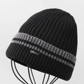 Detail of black ribbed knit beanie with grey stripes and silver metal sport emblem - Black