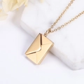 Golden envelope pendant necklace in titanium steel on white marble background - Gold Plain