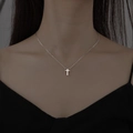 Minimalist silver cross necklace with thin chain on model for a sleek aesthetic look - Simple Small Silver Cross (5784101)