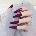 Close-up of deep purple long coffin press-on nails with a high-gloss UV finish - Deep Plum (CBLL-19)