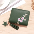 Dark green leather mini wallet featuring floral embroidery and star tassel detail - Green
