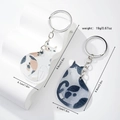 Cute calico and blue-white cat acrylic keychains on a white display stand for couples - Acrylic Couple Cats 1 Pair