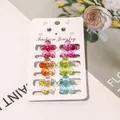 Detail of six mini flower hair claws in colorful jelly colors on a jewelry card - Gradient Five-Leaf Flower