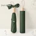 Three-fold dark green umbrella with round wooden handle and elegant bow ornament - Forest Green