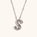 Detailed macro view of 18K silver-plated alphabet S balloon pendant with polished mirror finish - Steel-S
