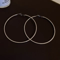 Macro shot of silver large hoop earrings featuring high polished metallic finish - Large Hoop (Silver Pin) / Silver