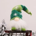Green striped Christmas gnome plush with white snowflake hat on a vintage sleigh - Green Forest Man Doll With Light (E-DD03)