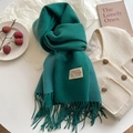 Green cashmere-feel winter scarf with tassels and aesthetic brand tag on beige fabric - 200x68cm / Lake Green