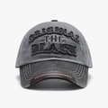 Gray washed canvas baseball cap with black embroidered text and brown leather trim edge - Adjustable / Smoke