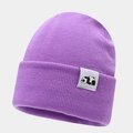 Close-up of purple knit beanie featuring a white woven label with black panda icon - Purple