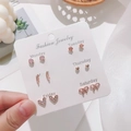 Set of six rose gold stud earrings featuring heart, flower, and gem designs on card - Rose Gold Feather Gemstone Style (E0148-1)