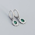 Silver drop earrings featuring oval emerald green zircon stones and halo diamond accents - 925 Silver / White Gold