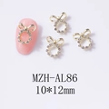 Dettaglio di un charm per unghie a fiocco dorato con strass da 10x12mm per manicure - Stile Fiocco con Strass Oro (AL86)
