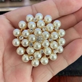 Elegant flower-shaped faux pearl cluster brooch with gold-tone base and small rhinestones - Concentric Pearl Cluster