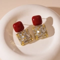 Macro shot of vintage dark red resin and gold-tone base earrings with crystal rhinestones - 925 Silver Post Style / Red Square Rhinestone