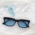 Cat eye oversized sunglasses with bold black frame and light blue lenses for women - Black and Blue