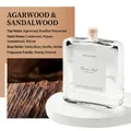 Oud Wood room diffuser in flat glass bottle with natural cork and wooden scent notes - Oud Wood