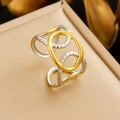 Macro detail of mixed gold and textured silver geometric open ring on velvet box - Geometric Crossed Design (R568)