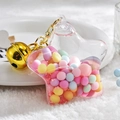 Star-shaped acrylic keychain with colorful macaron beads and golden bell charm - Bell Style / Pink