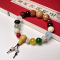Close-up of mixed bodhi seed bracelet with colorful agate beads and a yellow gourd charm - 2nd Gen Value - Zijin Bowl Style