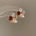 Detail view of colorful floral stud earrings with rhinestones, pearls and gemstones - 55# Silver Pin - Gold Red
