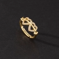 Macro shot of gold adjustable ring with sparkling micro-paved cubic zirconia hearts - Double Heart Bow Pave Style
