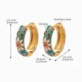 Detail view of gold-plated stainless steel hoop earrings with colorful floral enamel - Blue