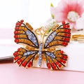 Colorful crystal butterfly keychain in gold finish with vibrant red and blue rhinestones - Multicolor Red Blue Butterfly