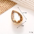 Detail of tear-drop gemstone shoe charm in golden metal base with size 2.7cm measurements - C237 20*27 Champagne Gemstone