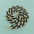 Macro view of black and gold chunky acrylic resin chain strap with spring metal buckles - Black & Gold