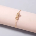 Bracciale testa di leopardo dorato con zirconi bianchi brillanti e occhi in gemma verde - Braccialetto Testa di Leopardo (SE1114)
