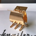 Macro shot of a minimalist gold metal hair claw clip reflecting on a white surface - 1# Gold 3.2cm Plain Claw Clip