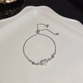 Adjustable silver butterfly bracelet featuring cubic zirconia and a bolo clasp design - S274 Silver