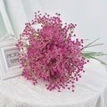 Pink gypsophila bouquet with green stems on white fabric for elegant home decoration - Rose Red