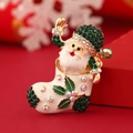 Vintage Santa Claus brooch with green rhinestones and colorful enamel on a golden base - Santa Claus Green