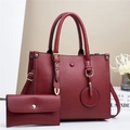 Dark red lychee pattern tote bag and wallet set with gold hardware in casual setting - Red