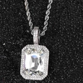Macro shot of silver hip hop pendant featuring large emerald cut cubic zirconia and rope chain - White Gold with Clear Stone (Pendant Necklace)