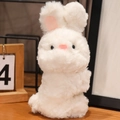 Plush white bunny slap bracelet for kids made of soft faux fur with pink accents - Sitting Rabbit