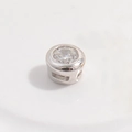 Macro shot of S925 silver cylinder bead with a round brilliant-cut white zircon inlay - Platinum Round Bead