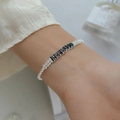 Elegant silver bracelet featuring black rectangular crystals and white pavé cubic zirconia - Single Row Black