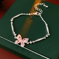 Detail of silver bracelet with pink zircon butterfly pendant and delicate micro-pave crystals - Butterfly Pendant Bracelet / Silver-Pink