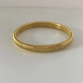 Classic gold Tubogas stretch bracelet in stainless steel with a textured spring design - 8mm Wide / Gold