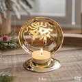 Portacandela dorato in metallo con campane natalizie e candela tealight accesa - Campana di Natale