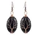 Macro detail of handmade bronze wire-wrapped tree of life earrings with black stone - Antique Copper + Obsidian