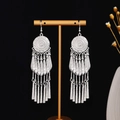 Bohemian silver tassel drop earrings with vintage geometric fish design on a T-stand - Round Carved Leaf Tassel E2836-4