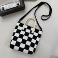 Detailed close-up of a black and white checkerboard knit tote with leather handles - 16cmx20cm / Black & White