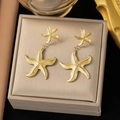 18K vergulde roestvrijstalen zeester oorringen gepresenteerd in een luxe geschenkdoos - Dubbele zeester oorbellen / Goud