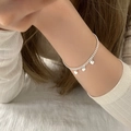 Close-up of a double-layered silver bead bracelet with heart charms on a wrist - Double Layer Silver Heart (MY30971)
